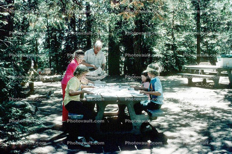 Family at a picnic table, man, woman