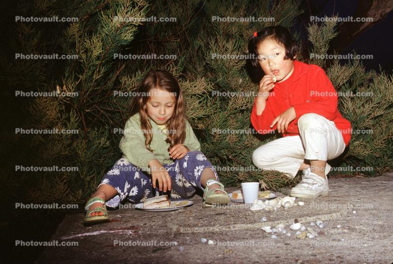Two Girls Eating Picnic Dinner, June 2000