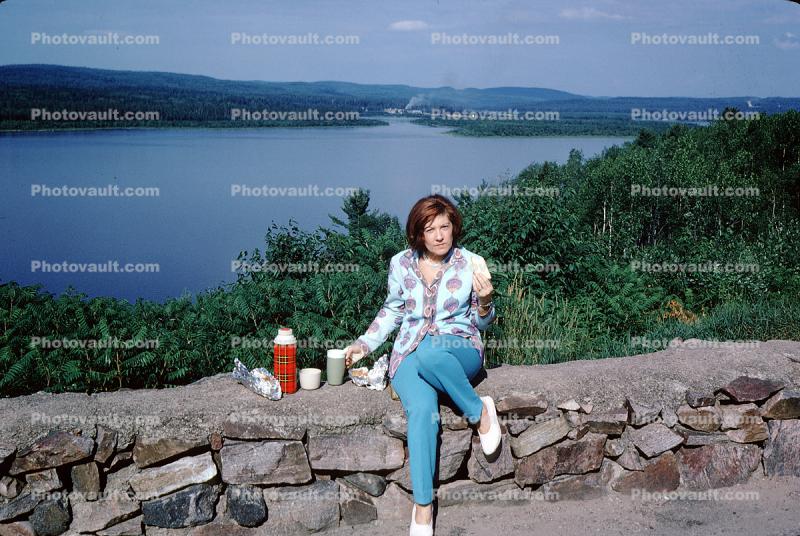 Woman Overlooking a Lake, Pants, Thermos, Rock Wall, 1960s