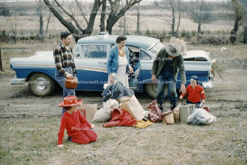 Ford Fairlane, roadside picnic, girls, men, woman, toddler, 1950s