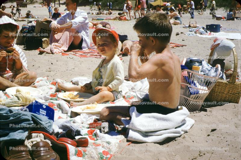 Girl and Boys on a Crowded Beach, food, towels
