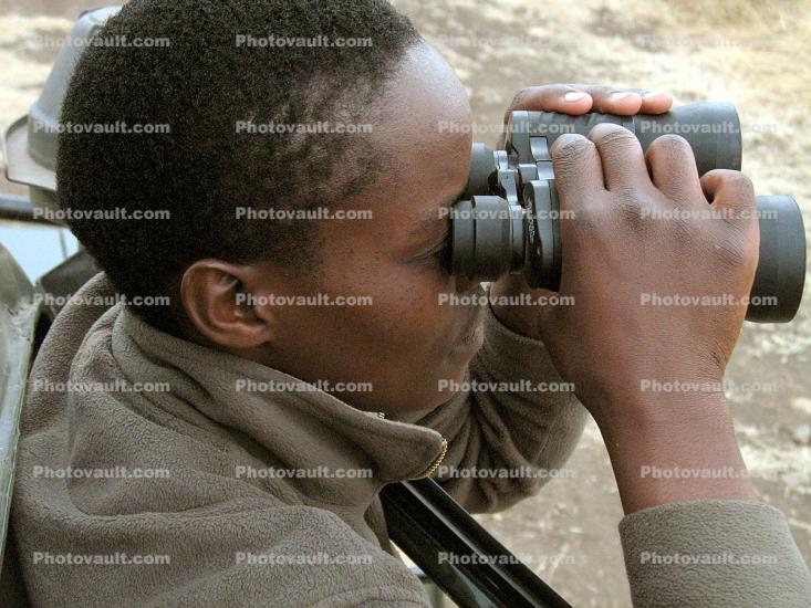 Boy looking through Binoculars
