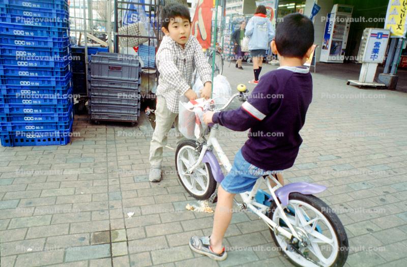 Boys riding a bike