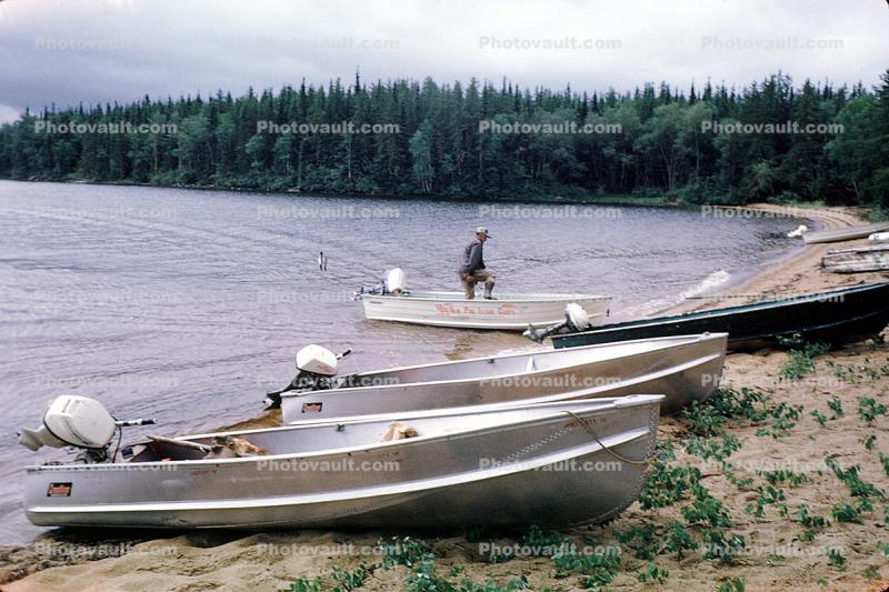 fishermen, outboard motor boats, lake, beach, forest, woods, fish catch, Nungesser, Ontario, Canada, 1970, 1970s