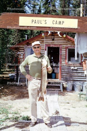 Paul's Camp, fishermen, man, fish catch, Nungesser fish, Ontario, Canada, 1967, 1960s
