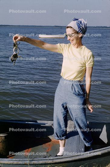 Thelma with Crabs, fisherwomen, woman, fish catch, crabs, Outer Banks, North Carolina, 1960s