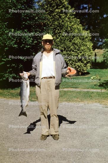 Man Shows Off Fish, trout