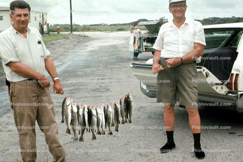 fishermen, string of fish, fish catch, 1962, 1960s