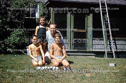 Boys, Fish catch, backyard, brothers, Cape Cod, Massachusetts, 1950s