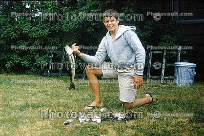 Fish Catch, smiling boy, backyard, Cape Cod, Massachusetts, 1961, 1960s