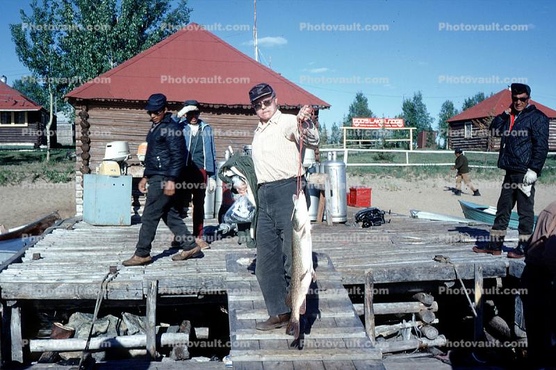 Happy Camper, fish, fisherman, dock, fish catch, man, male, Gods Lake Lodge, Manitoba, Canada, 1970, 1970s