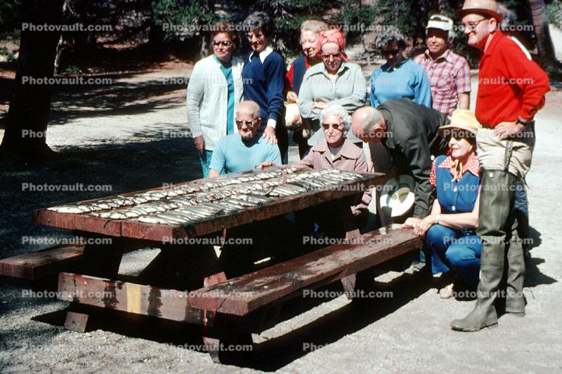 fish catch, men, women, picnic table, waterproof fishing pants, 1976, 1970s