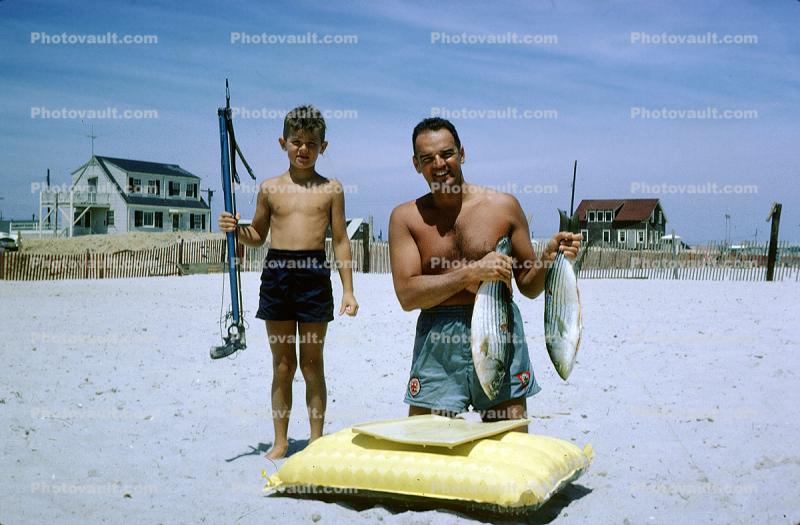 Boy with a Spear Gun, swim trunks, raft, Fish, Beach, Sun Tan