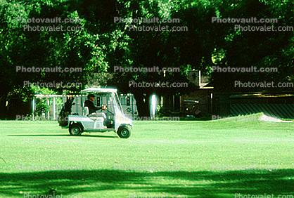 Golfer, golf cart