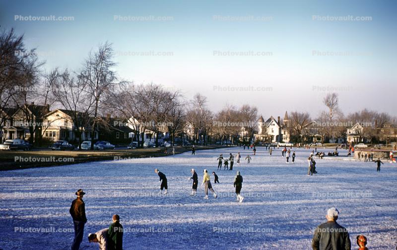 frozen pond, outdoor rink, homes, houses, buildings