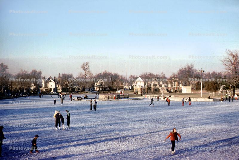 frozen pond, outdoor rink, homes, houses, buildings