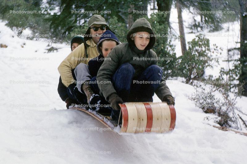 Family on a Sled in the Snow, Ice, Cold, Smiles, fun, jackets, 1950s