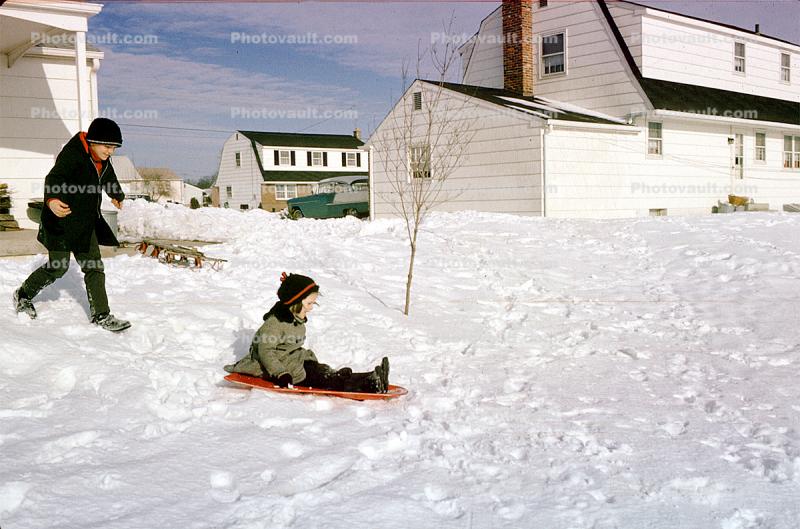 Boys Sledding at Home, Car, Houses, Winter, 1950s
