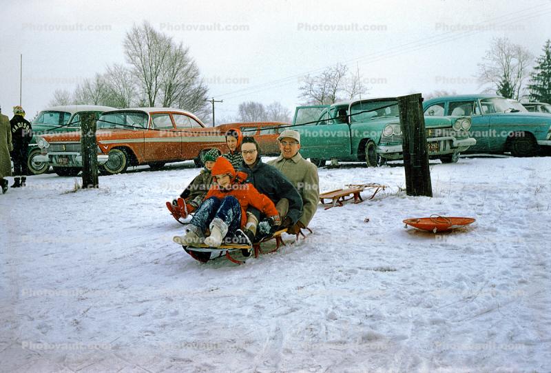 Family Sledding together, Snow, Ice, Winter, Parked Cars, 1950s