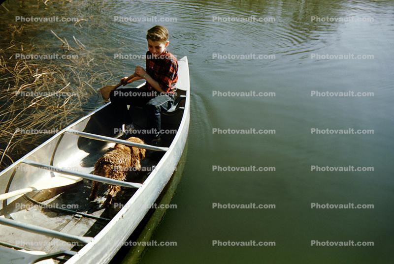 Boy Paddling a Canoe