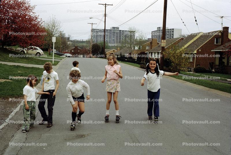 Kids Roller Skating on the Street, Girls, Boys, fun, suburbs, 1960s