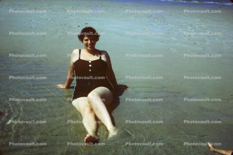 Lady sitting in water