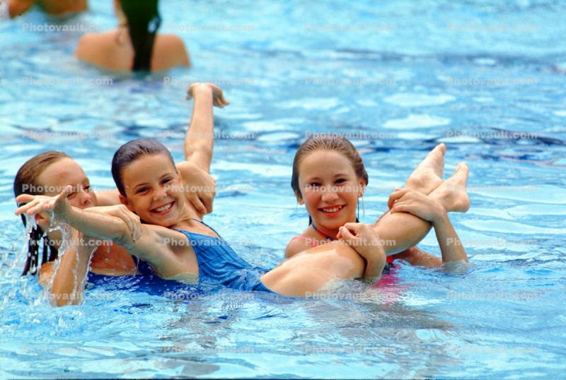 Girls smiling, swimming pool