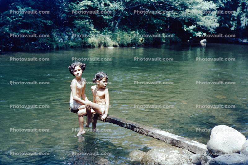 Two Girls sitting over a gentle River, 1940s