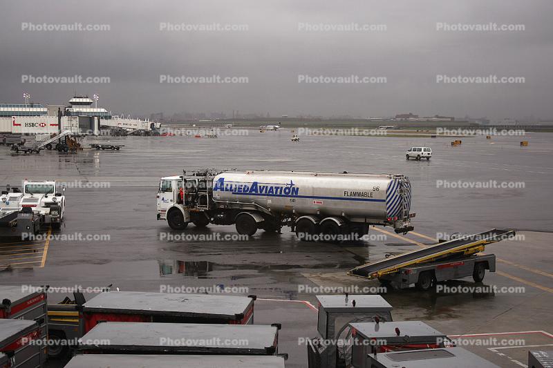 Allied Aviation fueling truck, LaGuardia Airport (LGA), Ground Equipment, belt loader, carts, rain, rainy, inclement weather, precipitation