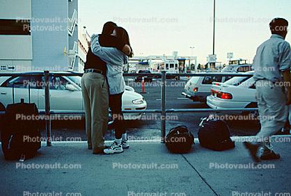 Hugging Couple, Bags, Cars, (BUR)