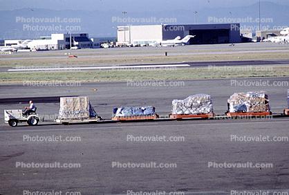 baggage carts, ground personal, boxes, box, hangar