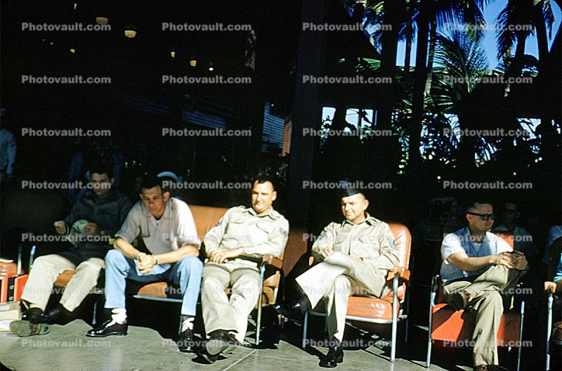 waiting for a flight, Hickam Field, men, seating, seats, sitting, Hickam Air Force Base, April 7 1956, 1950s