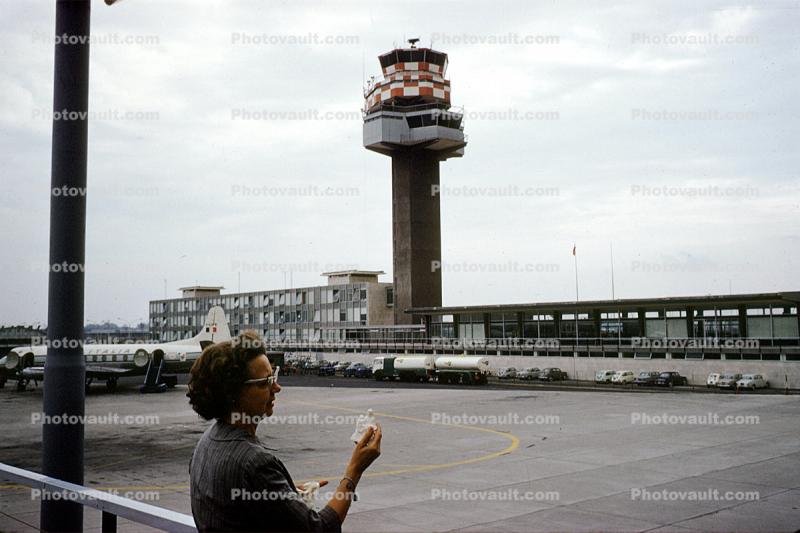 Woman, hand held device, mobile device, Rome, Control Tower, Building, Terminal, October 1961, 1960s