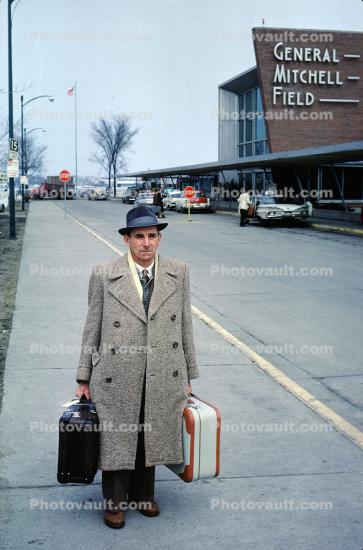 Man, Suitcases, overcoat, trench coat, cold, Terminal Building, Wisconsin, 1960s