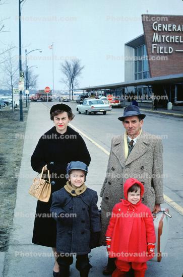 Family Group, Woman, Man, Suitcases, overcoat, trench coat, cold, Terminal Building, General Mitchell Field, 1960s