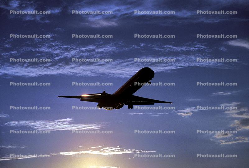 Landing Douglas DC-9, clouds, sunset, dusk