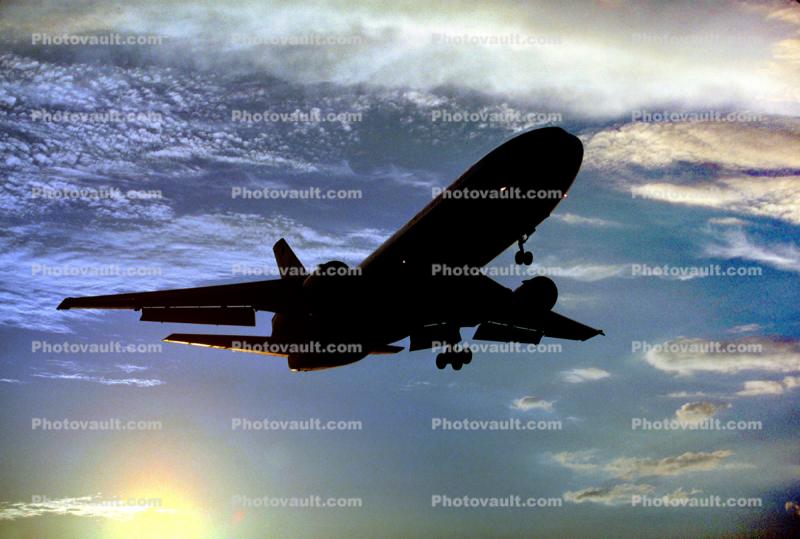 DC-10 landing, clouds, sunset, dusk