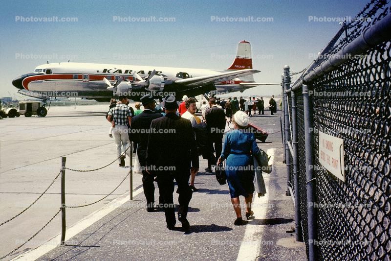 OH-KDB, Kar Air, Douglas DC-6B, Passengers boarding, men, women, 1950s
