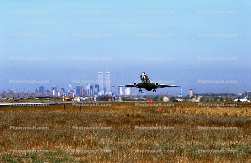 DC-10 taking-off wtih NYC Skyline