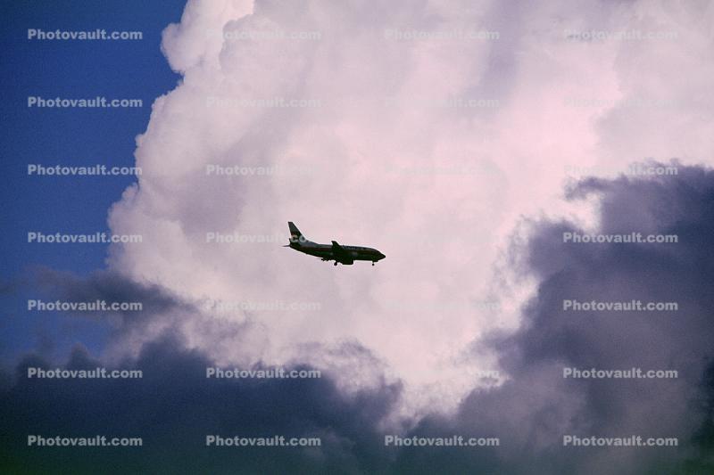 Boeing 737-300 flying in the Clouds