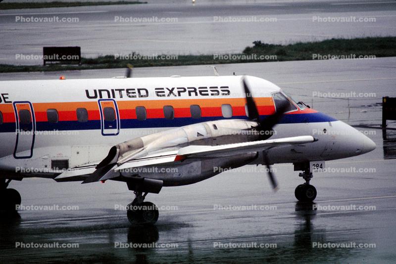 N268UE, United Express, SkyWest Airlines, Embraer EMB-120ER Brasilia, San Francisco International Airport (SFO), rain, inclement weather, wet, PW118