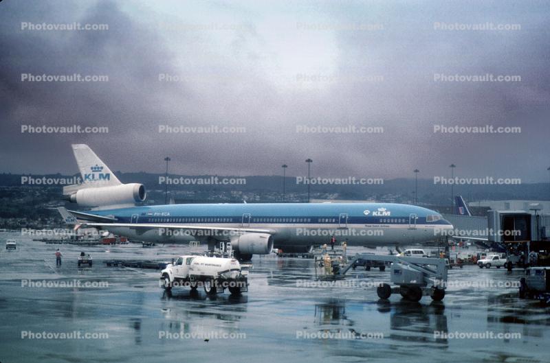 PH-KCA, MD-11 P, (SFO), KLM Airlines, rainy, inclement weather, wet, fuel truck, rain, CF6-80C2D1F, CF6