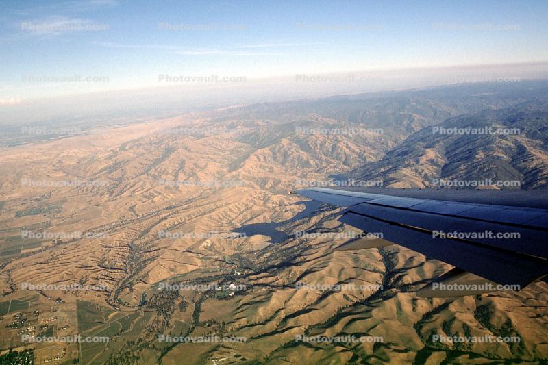 Boeing 737, Lone Wing in Flight, Mountains, Hills