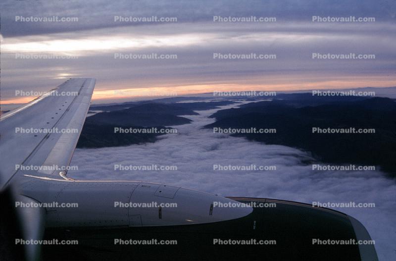Lone Wing in Flight, Fog, valleys, jet engine, CFM56, flying, airborne