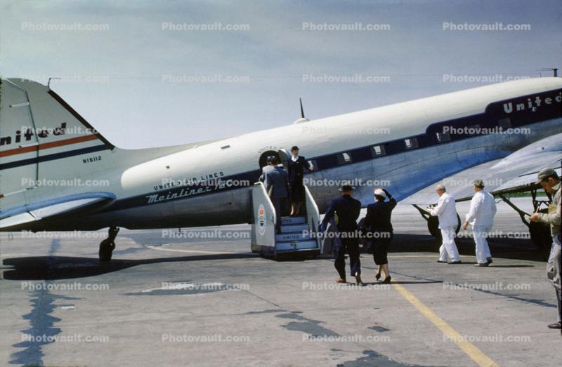 N18112, Douglas DC-3A-197, boarding passengers, stairs, steps, 1950s