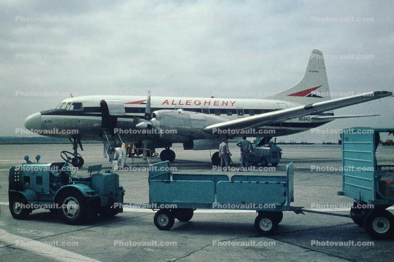 N5840, Convair CV-580, baggage carts, tractor