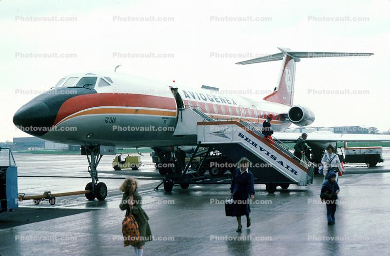 YU-AHS, Aviogenex, Tupolev Tu-134A, AHX, disembarking passengers, rain, Manchester Airport, May 1977
