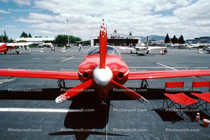 LANCAIR, red plane head-on, propeller, spinner