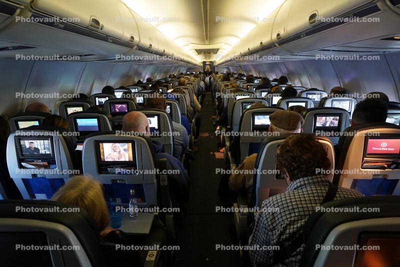 Screens, Monitors, Seats, crowded cabin