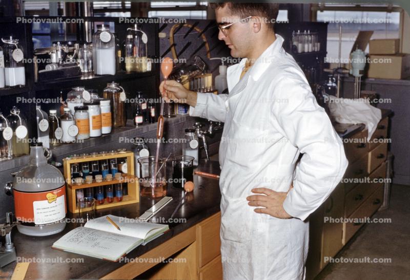 Man at a Chemistry Lab, coat, nots, test tubes, 1950s